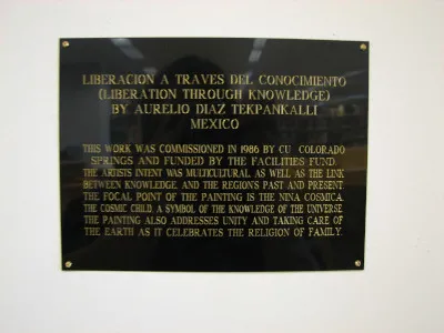 Photo of plaque about art piece "Liberation Through Knowledge"